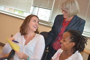 Adult Learning Students smiling and talking with professor